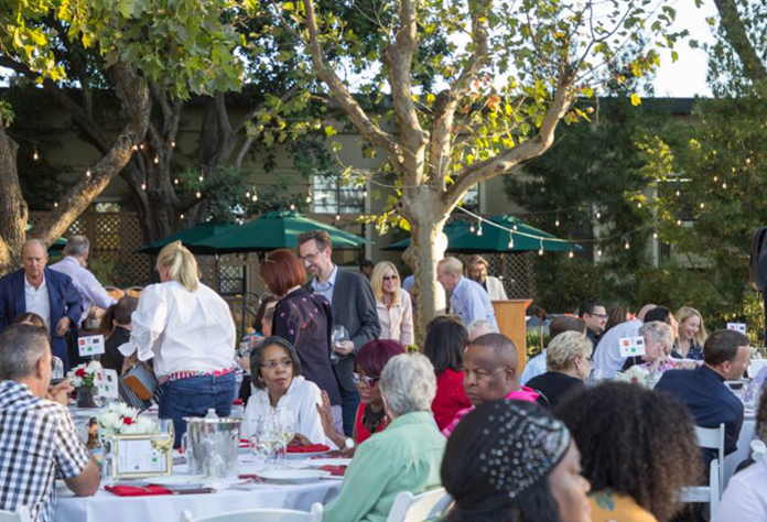 Crowd photo of people enjoying lunch at Saint Johns event