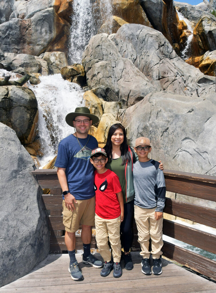 A vacation photo of Jeremy Spencer with his wife and two sons