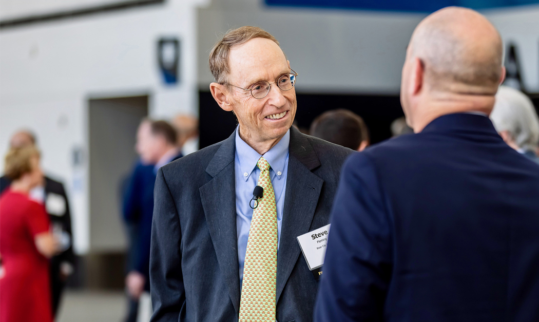 River City Bank's Steve Fleming chatting with a businessman